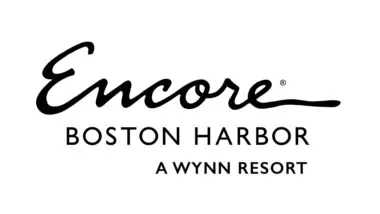 Logo of encore boston harbor, featuring elegant, cursive lettering for "encore" above the words "boston harbor" in capitalized, sans-serif font, followed by "a wynn resort" in a smaller script.