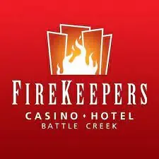 Logo of firekeepers casino hotel on a red background, featuring a stylized flame design with three white cards and orange-yellow flames, with "battle creek" below the main text.