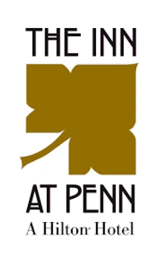 Logo of "the inn at penn, a hilton hotel" featuring stylized text with a prominent bold letter "n" in a golden color scheme.
