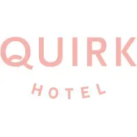 The logo of quirk hotel in a soft, pink hue featuring the word "quirk" in bold, capitalized letters over the word "hotel" in smaller uppercase letters.