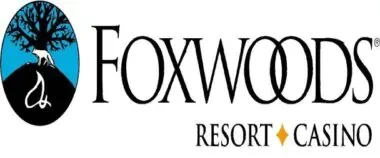 Logo of foxwoods resort casino featuring a stylized tree with a fox silhouette and text "foxwoods." the logo includes elements of nature and gambling iconography.
